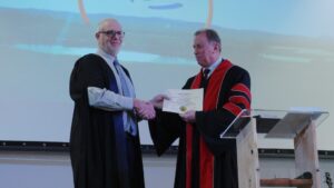 Dr Andrew Corbett, President of ICI College Australia, graduating Pastor Tony Boyle with a Bachelor of Bible and Theology from Global University.